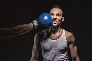 A boxer getting punched