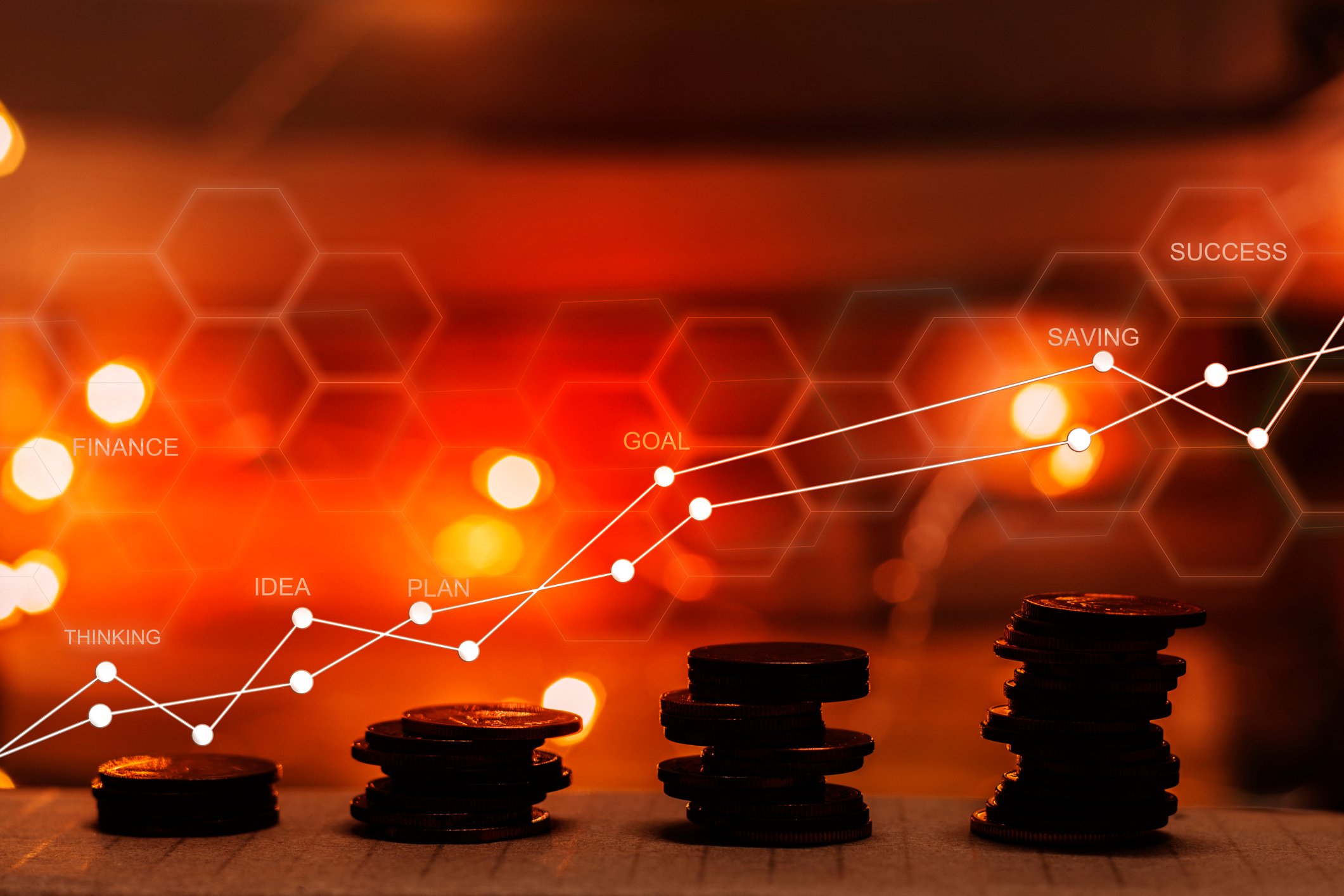 Stacks of coins with trend lines above