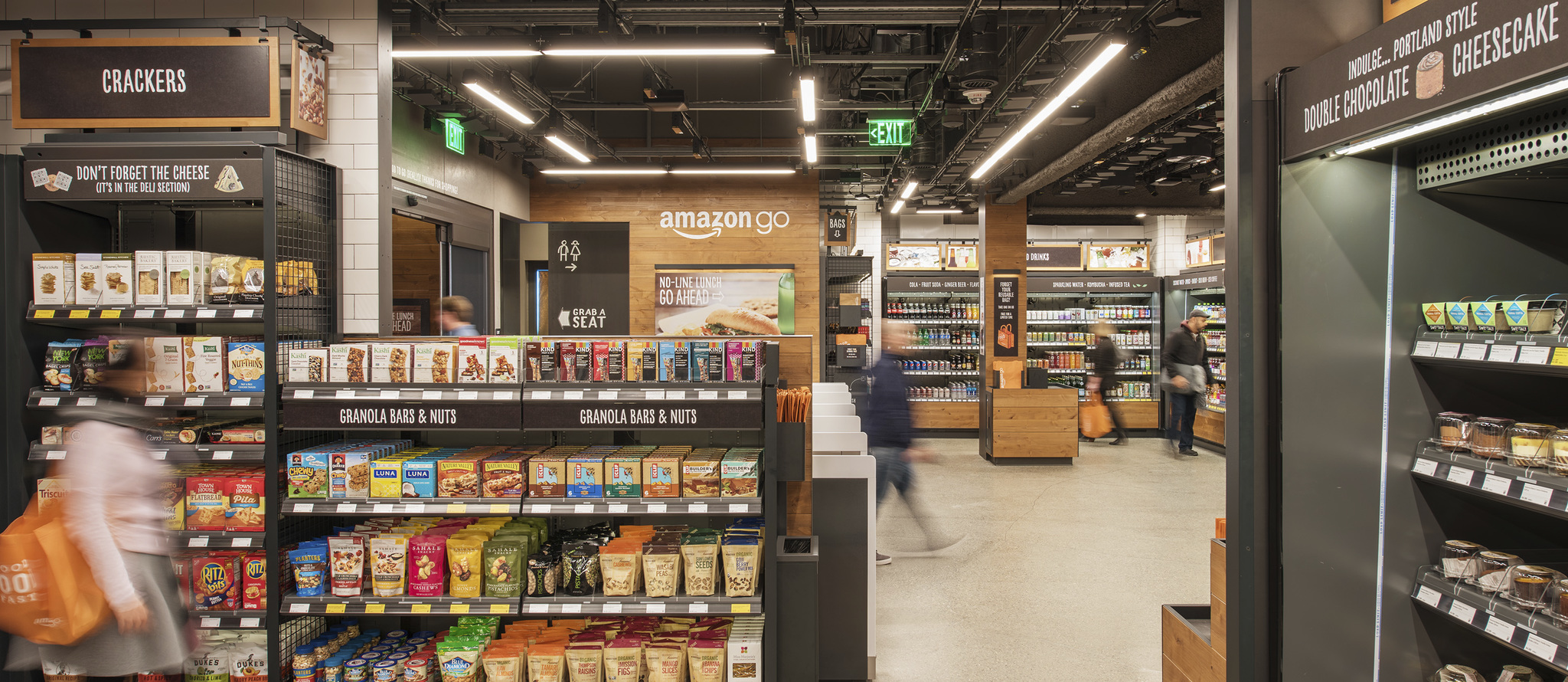 The interior of an Amazon Go store showing shelves stocked with grab-and-go items.