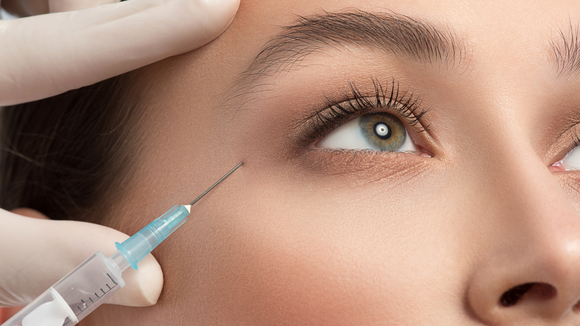 A patient receives a Botox injection.