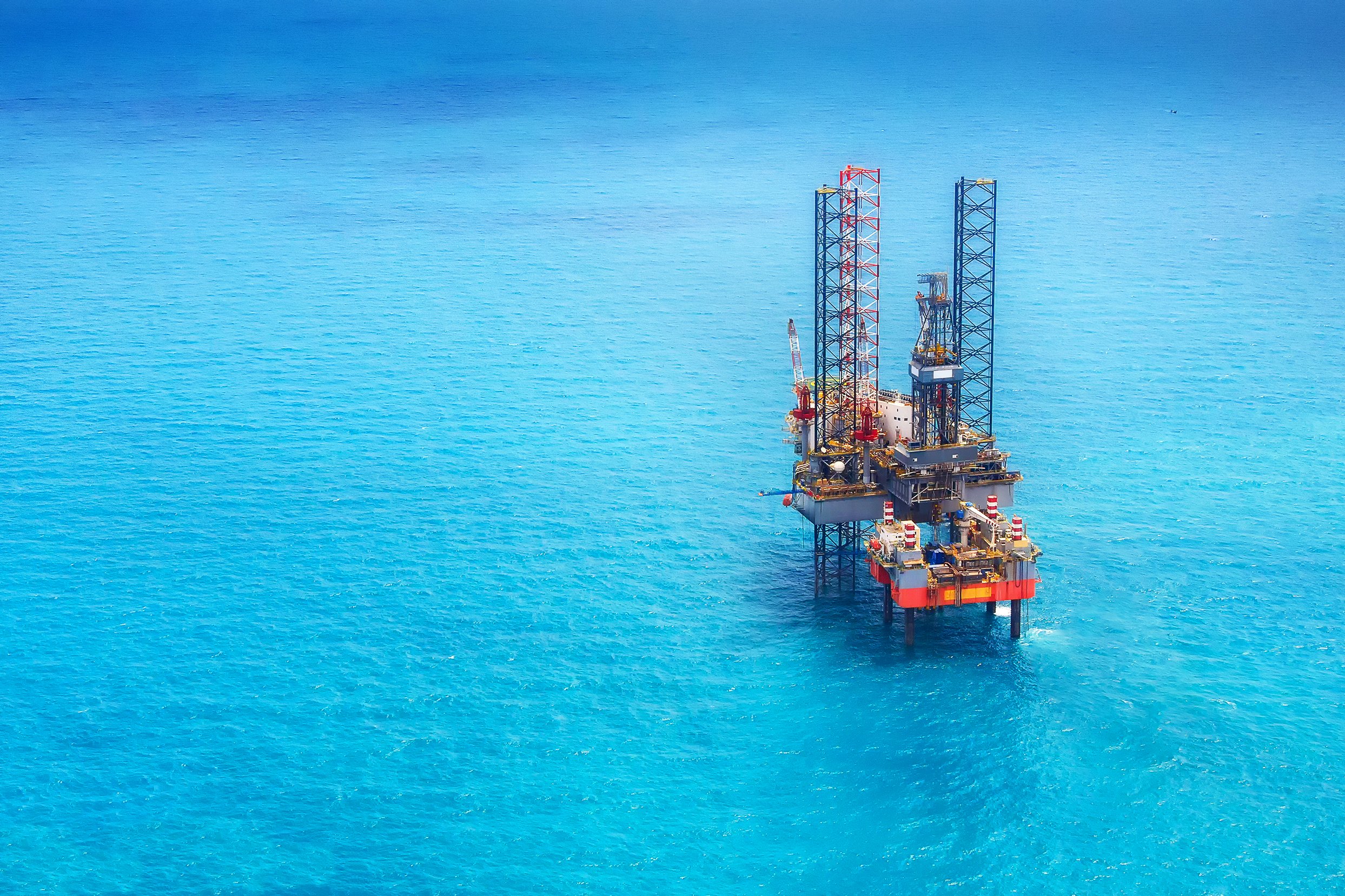 An offshore drilling rig in the open ocean.