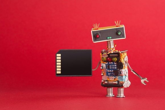 A robot holds an SD card.