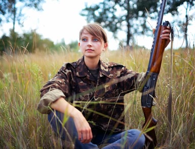 female woman hunter gun shotgun getty