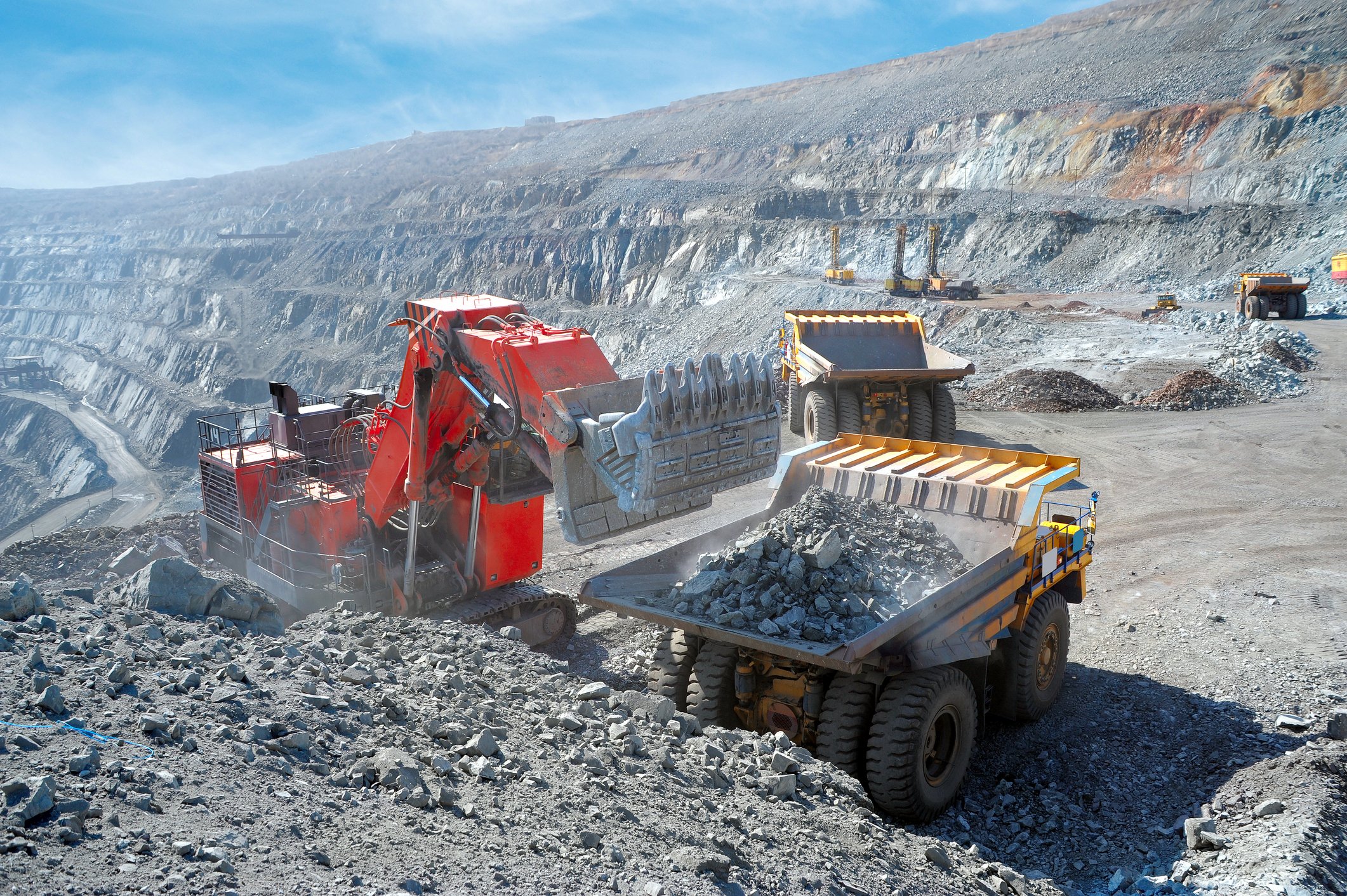 Iron ore loaded into a machine getty