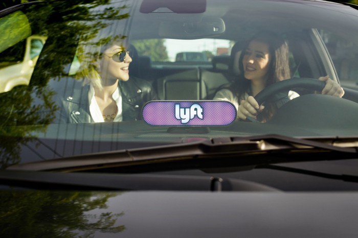 A Lyft ride with two women in the front seat