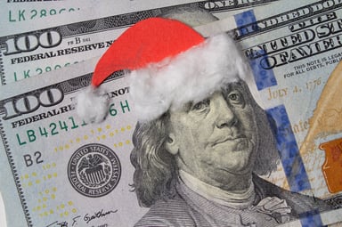 $100 bills with a Santa hat