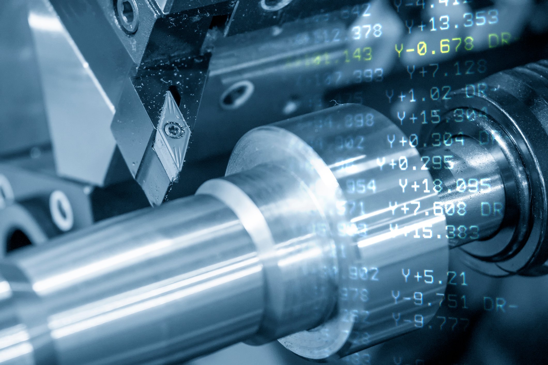 Computer rendering of steel machine parts, overlaid by a layer of numbers and calculations.
