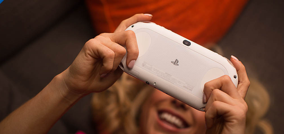 A gamer plays a game on a PS Vita.