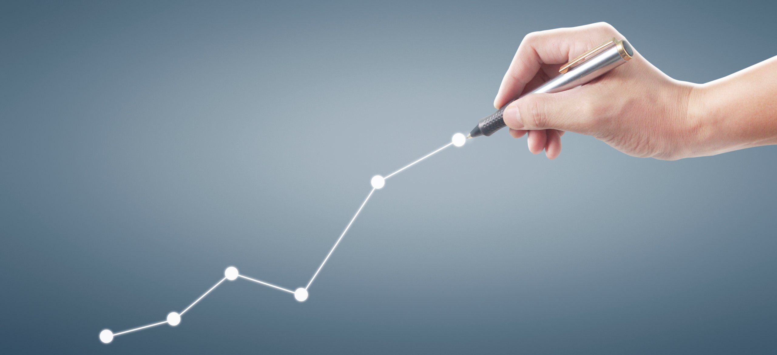 Hand drawing upward graph.