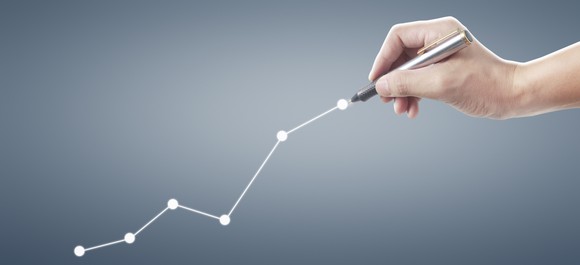 Hand drawing upward graph.