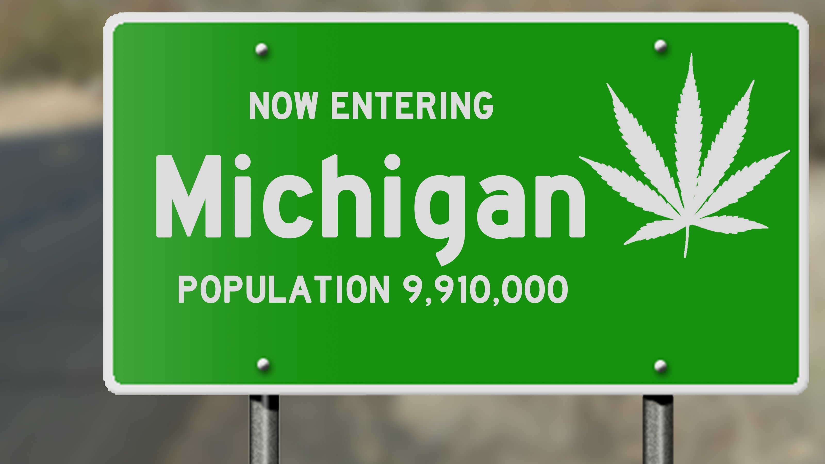 Michigan state sign adorned with cannabis leaf