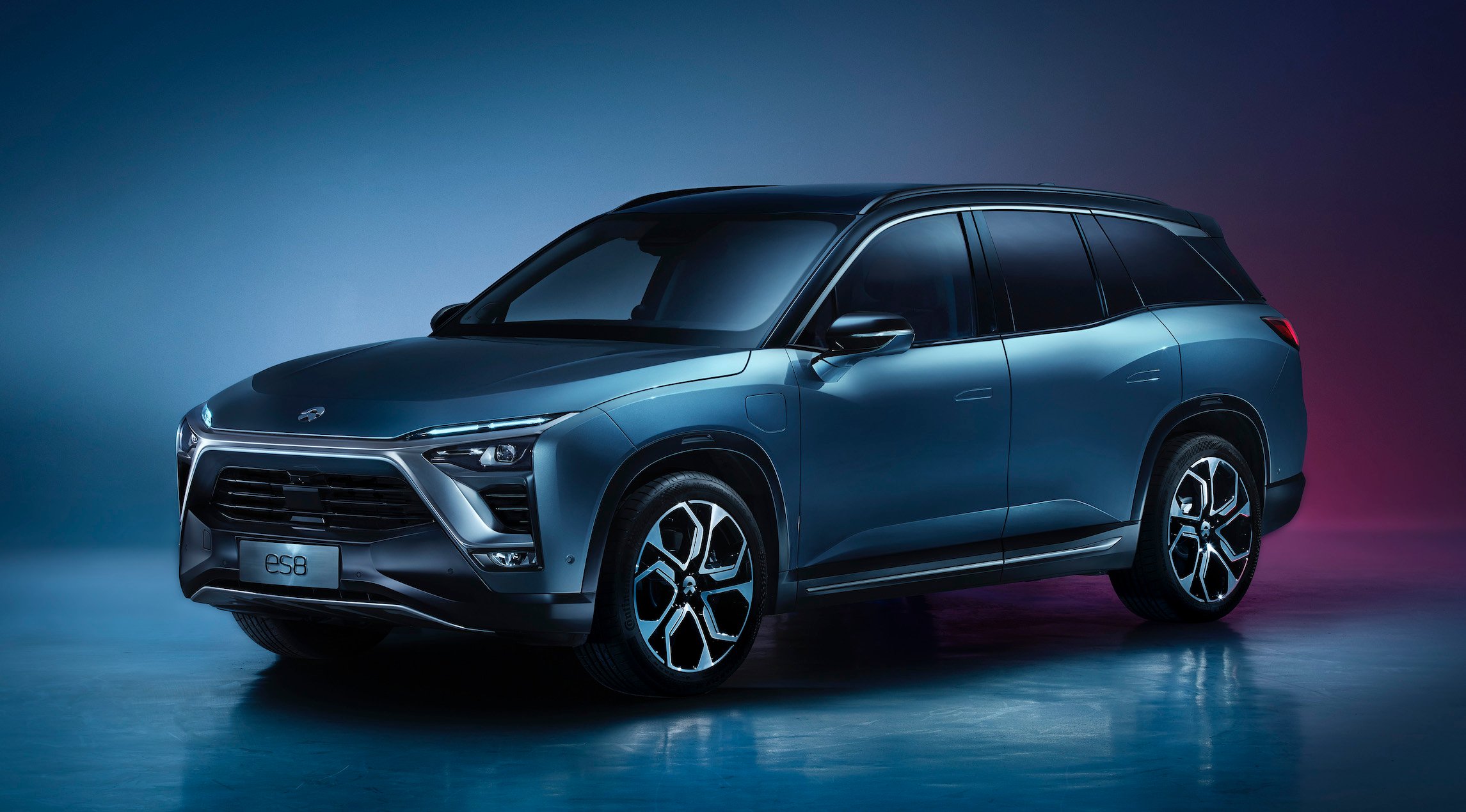 A blue NIO ES8, an upscale three-row electric crossover SUV