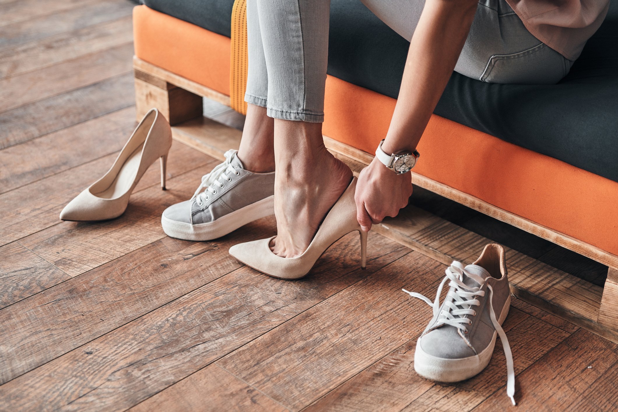 A woman trying on shoes in a shoe store.