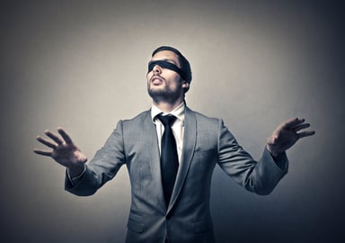 blindfolded man business