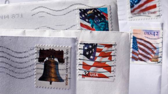 Canceled stamps on the corners of envelopes.