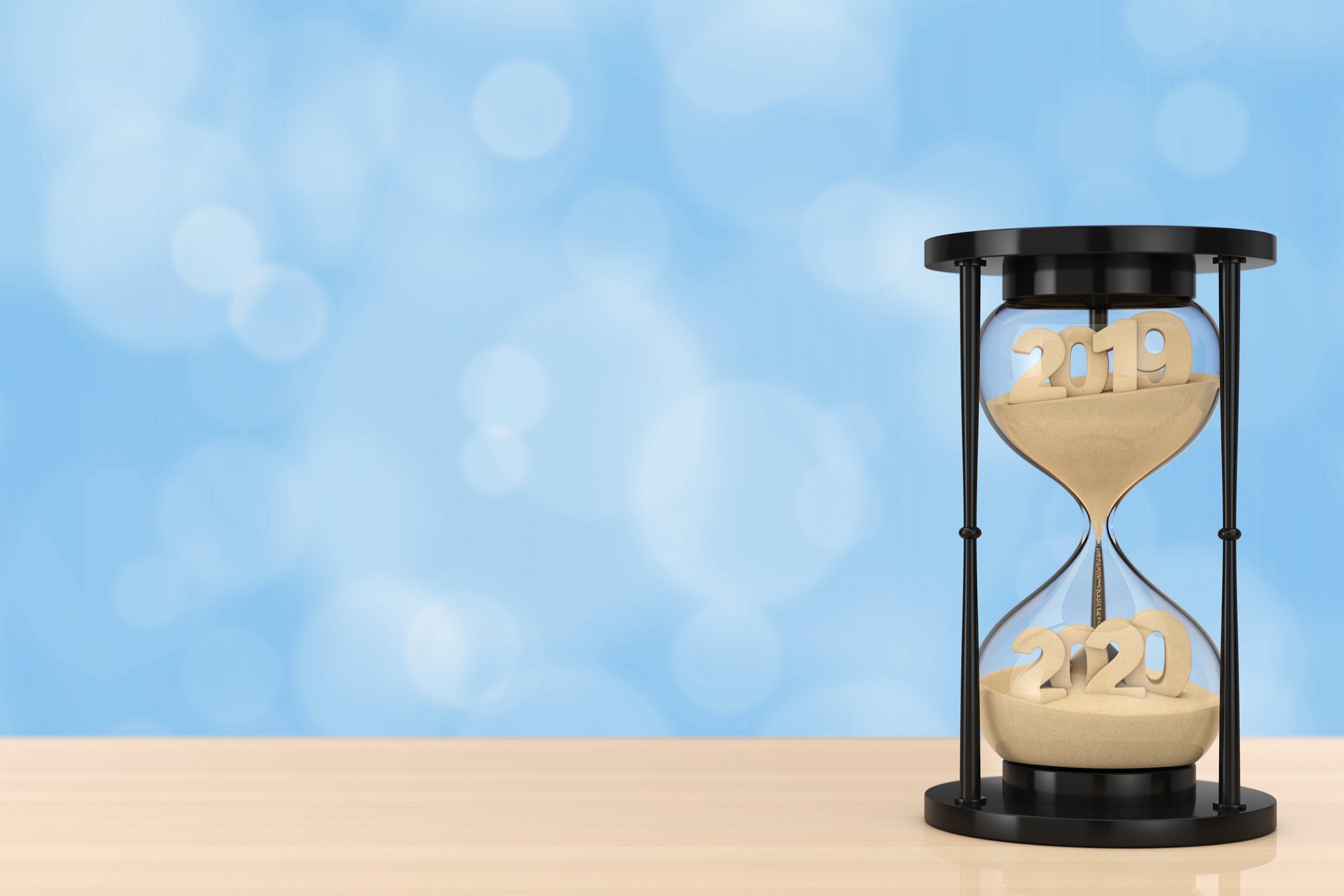 Hourglass with 2019 displayed in the top half and 2020 in the bottom half