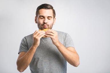 man holding a hamburger