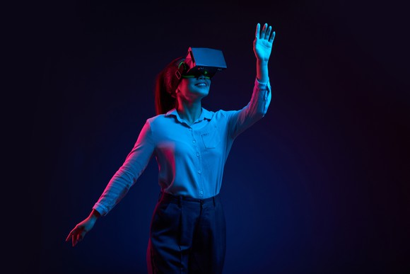 A woman wearing a virtual reality headset.