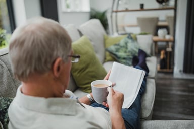 older man reading magazine_GettyImages-840849510