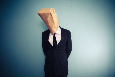 Businessman with bag over his head