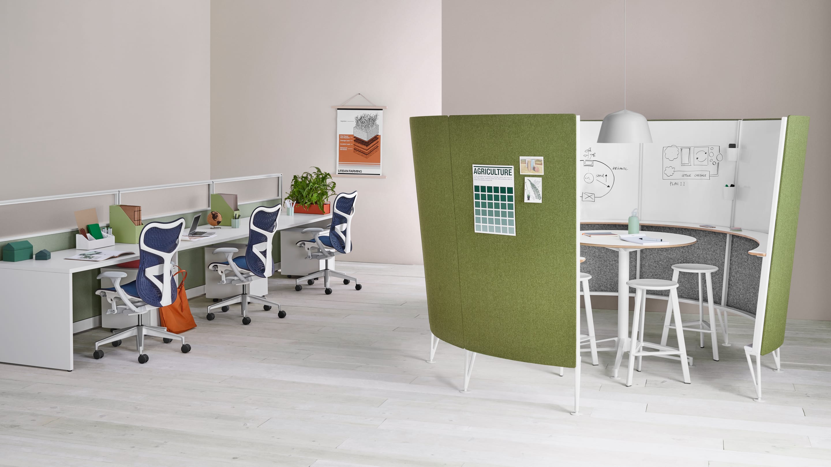 A collaborative office space featuring Herman Miller chairs, desks, and a semi-enclosed creative nook for brainstorming.