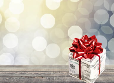 $50 bill box wrapped with red bow