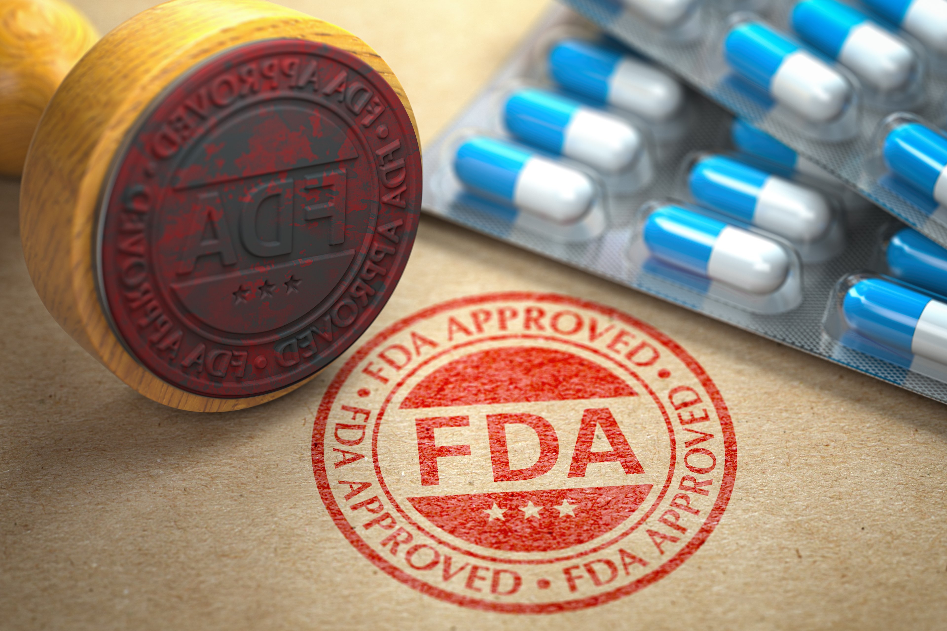 An FDA approval stamp next to pills