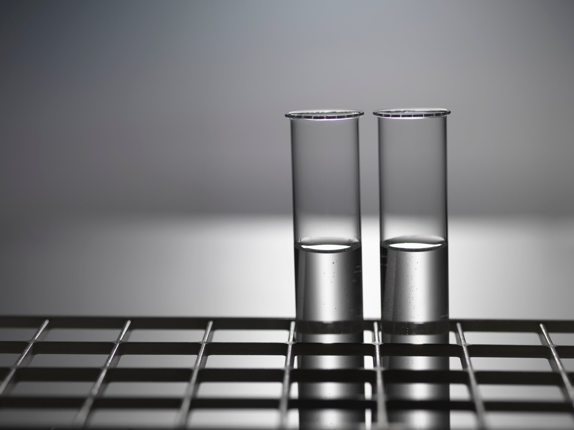 Black and white photo of two test tubes in a rack