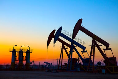 Oil pumping Unit at sunset time