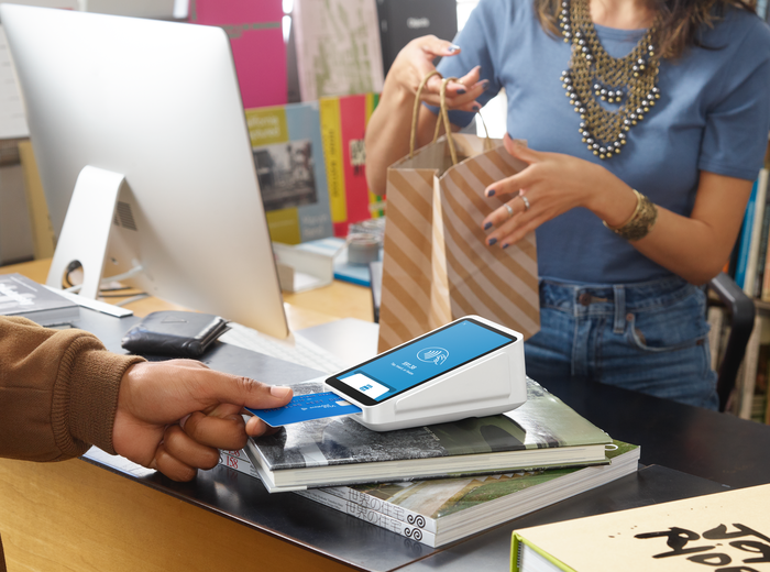 A person conducting a transaction on a Square machine