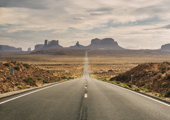 Photograph of a lone desert highway.