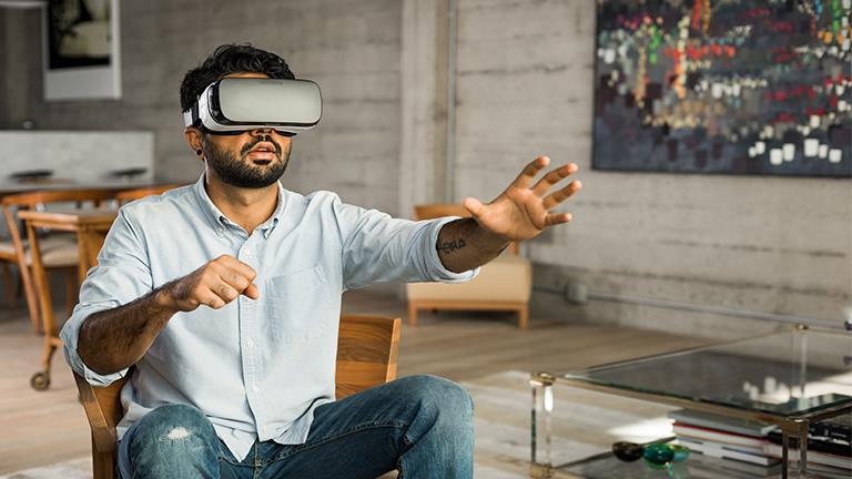 A man wearing an Oculus VR headset