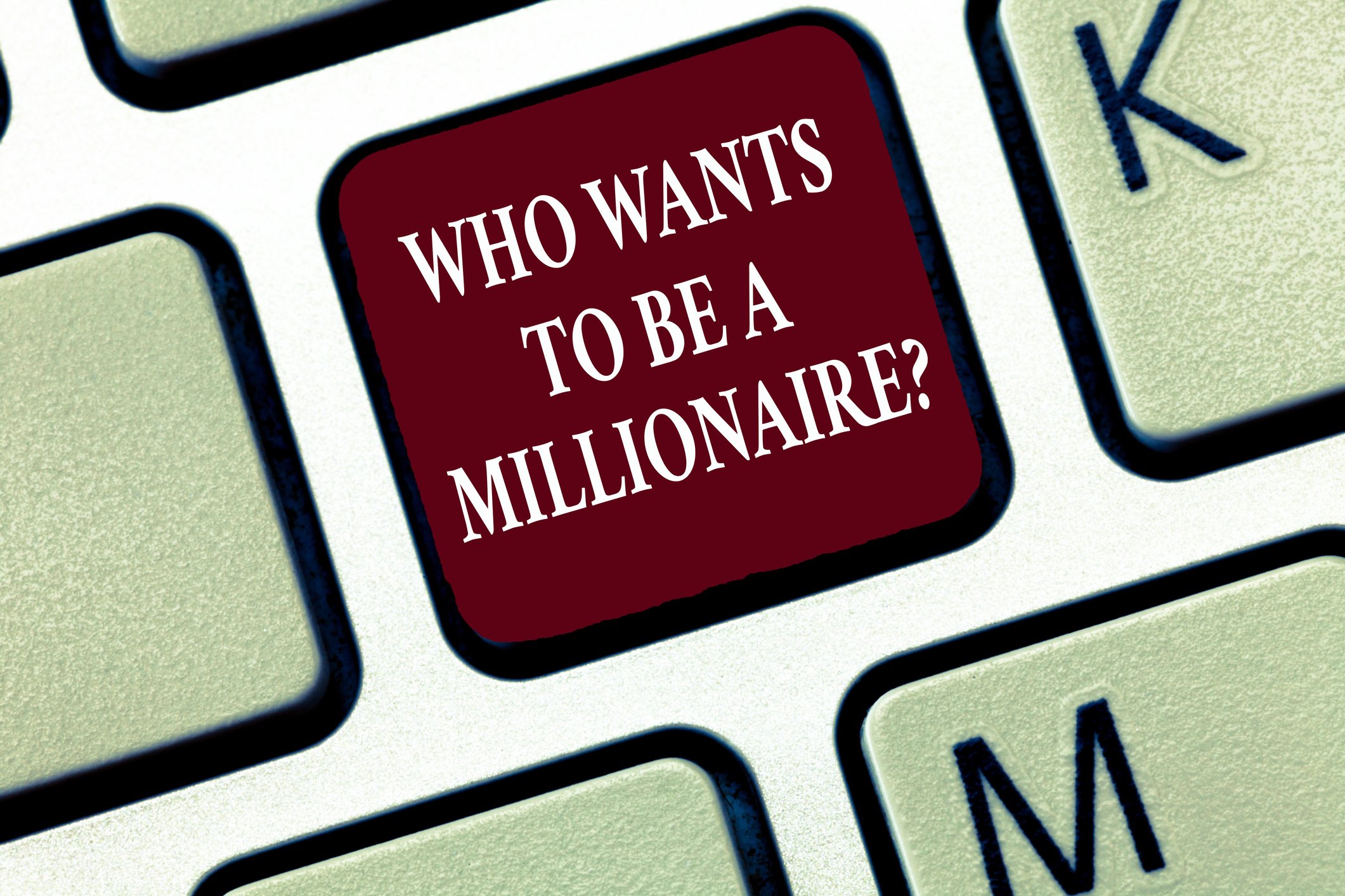 We see an illustration of a keyboard key, labeled who wants to be a millionaire?