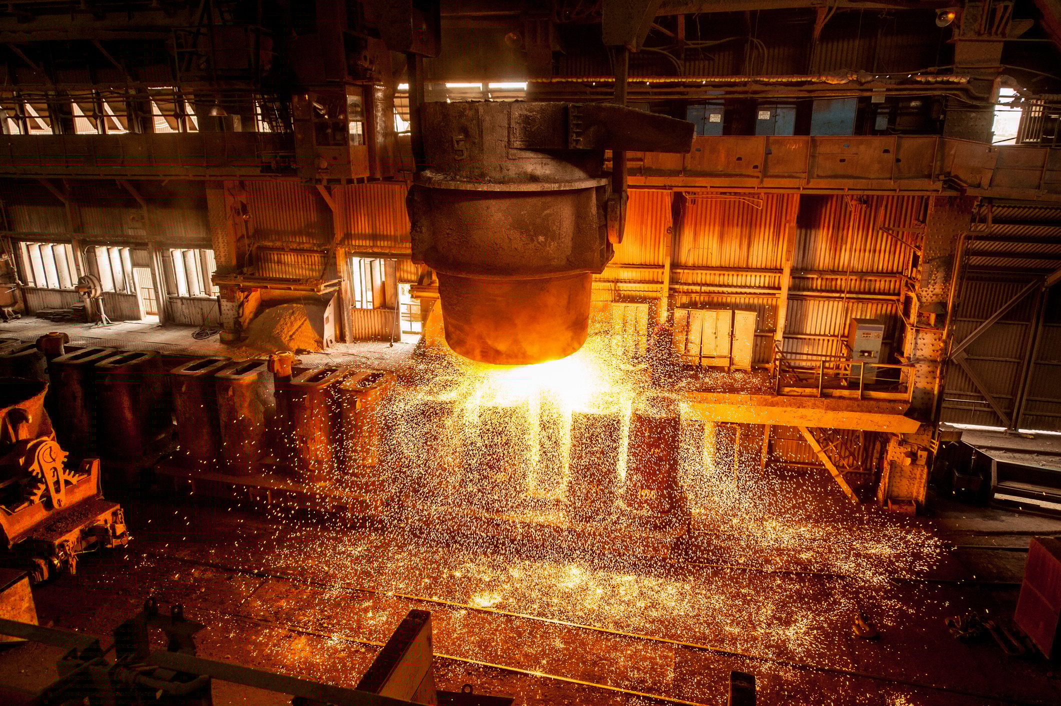 A tank spraying molten steel in a factory.