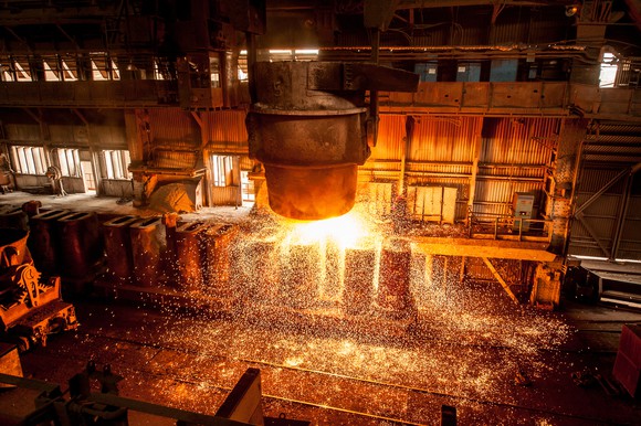A tank spraying molten steel in a factory.