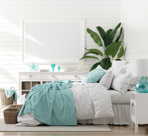 Bed with comforter, pillows, and other home decor.