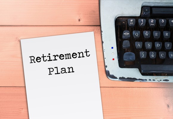 A sheet of paper next to a typewriter says retirement plan.