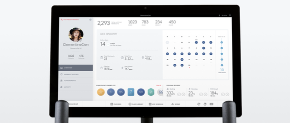 A screen attached to a Peloton bike displaying workout statistics.