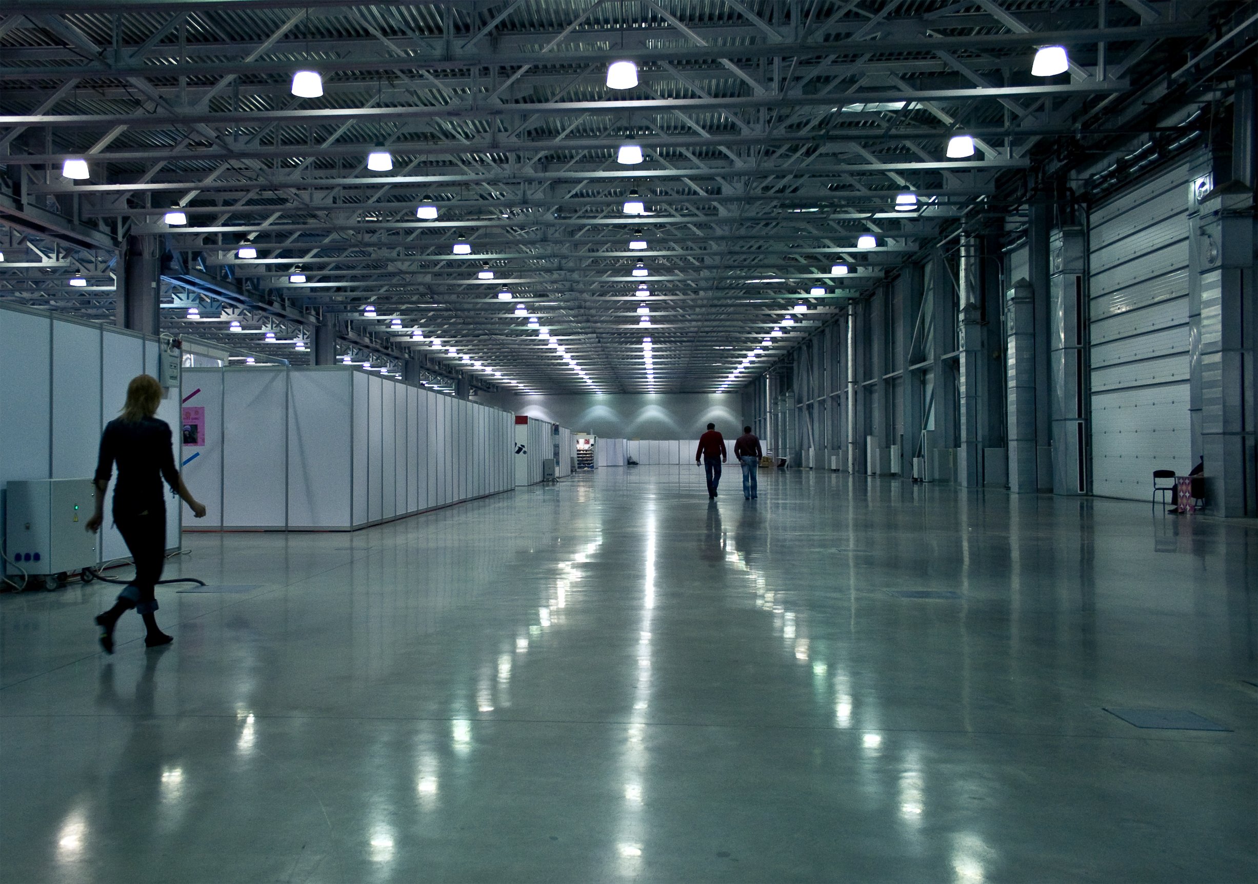 The brightly-lit interior of a modern industrial warehouse space.