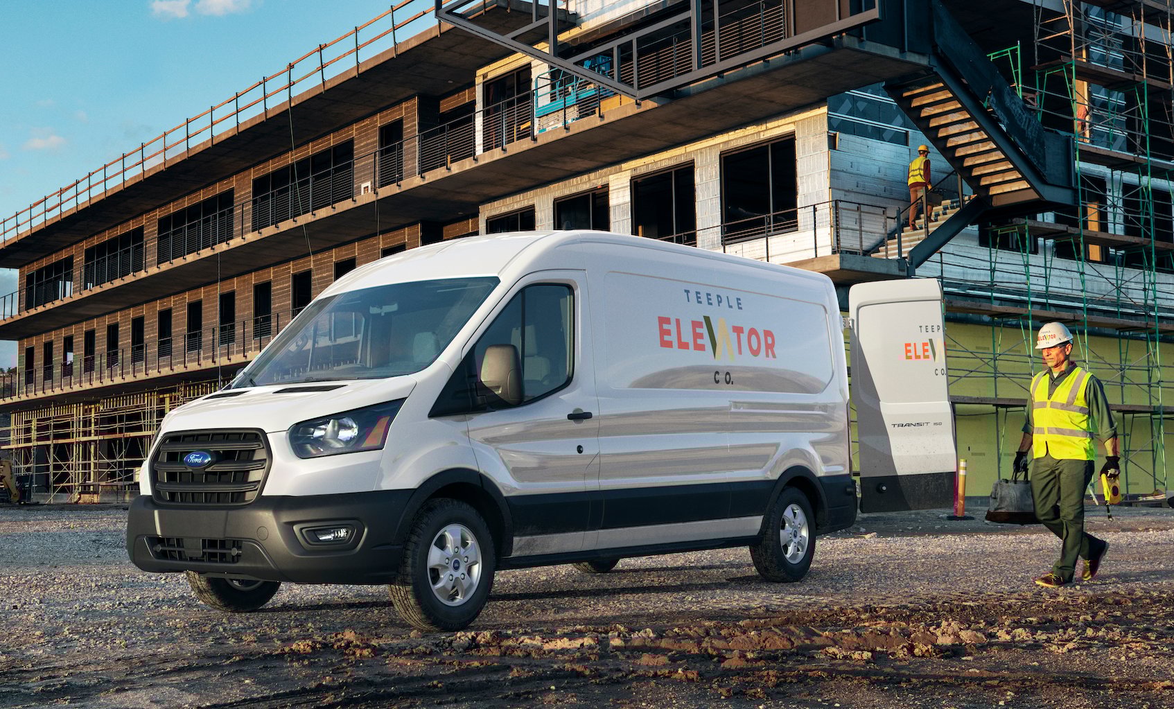 A 2020 Ford Transit, a commercial van, shown on a construction site.