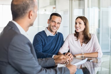 banker with clients source getty