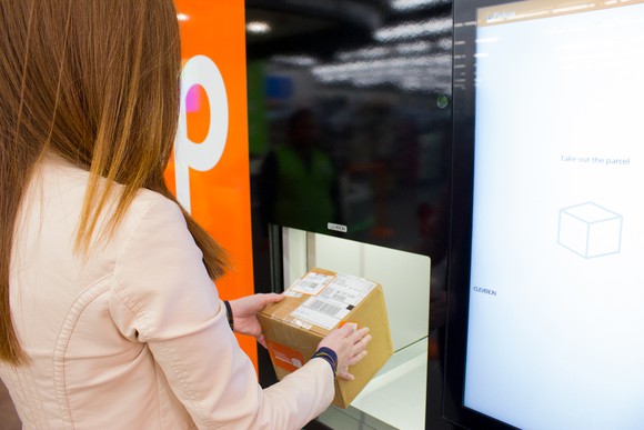Woman at pickup kiosk in Walmart