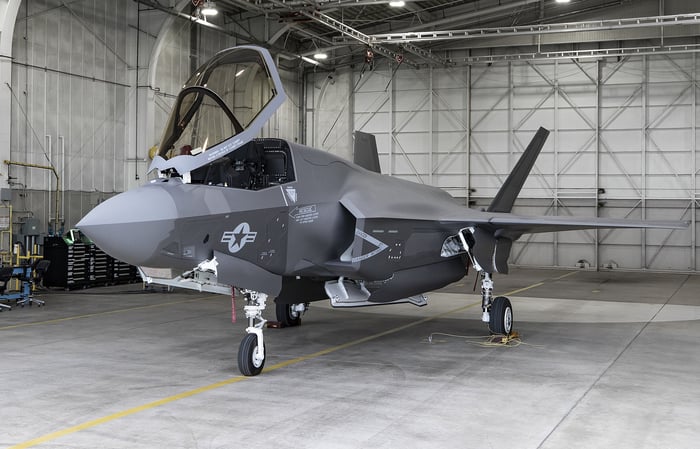 A Lockheed Martin F-35 fighter jet parked in a hanger.