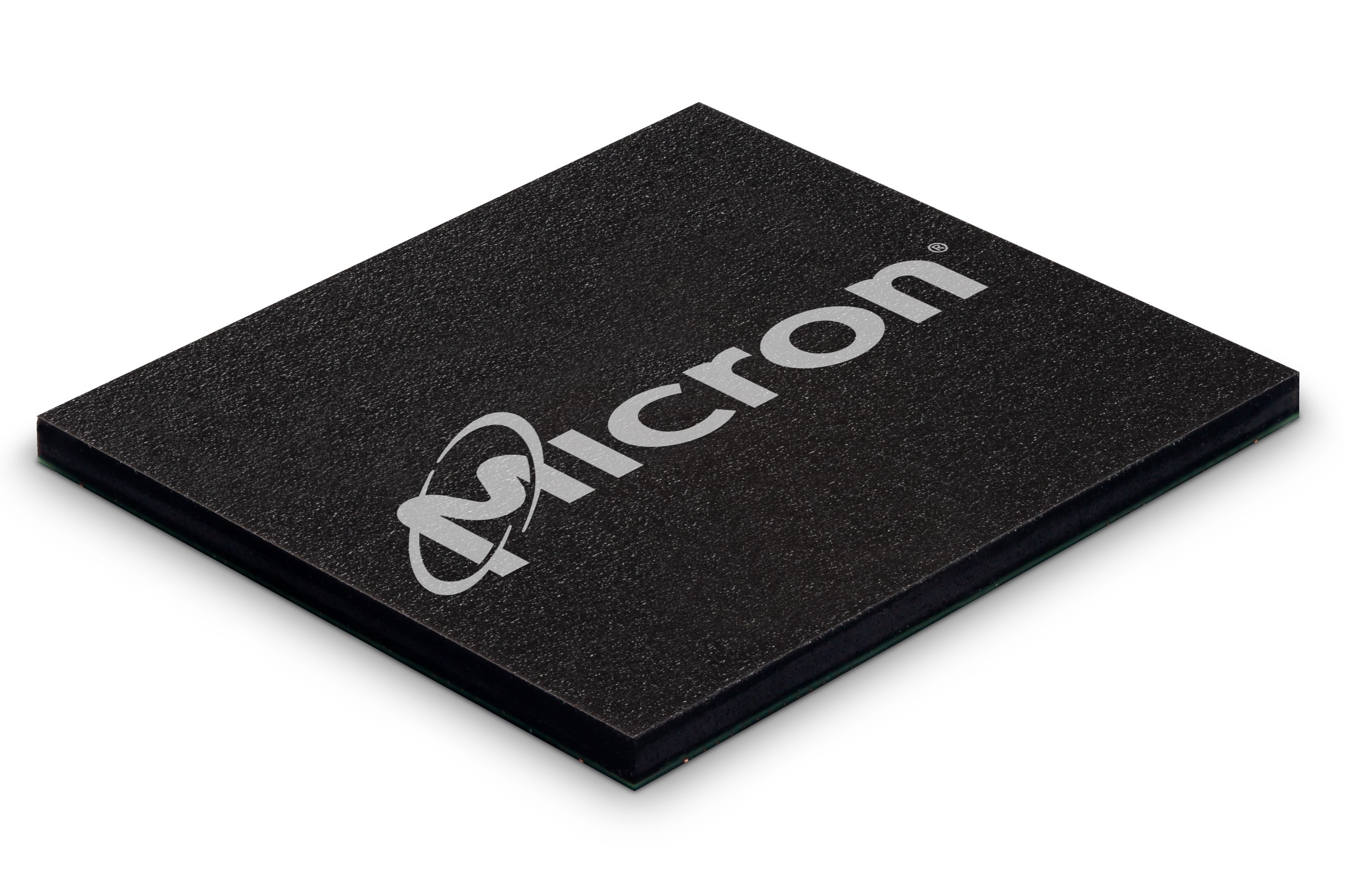 A black NAND memory chip marked with Micron's corporate logo written on it