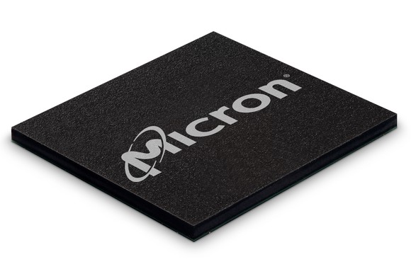 A black NAND memory chip marked with Micron's corporate logo written on it