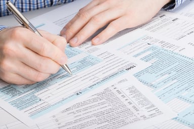 Man filling out tax form