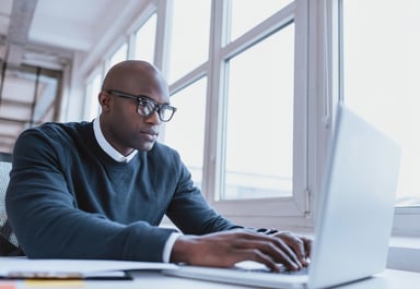 man typing on a computer_GettyImages-465102236