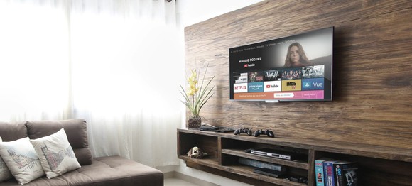 An Amazon Fire TV mounted on a living room wall.