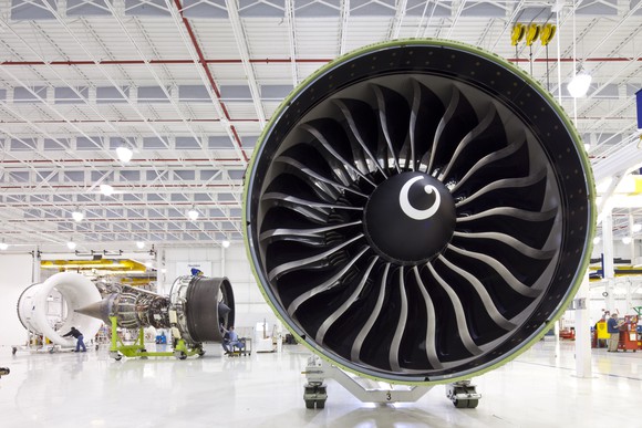 A GE90 jet engine sits on the factory floor of a General Electric engine plant