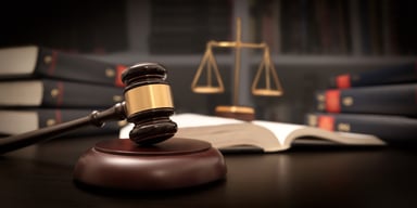 Gavel and scales of justice in court